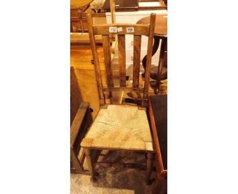 Single oak rush seated chair and a fire screen