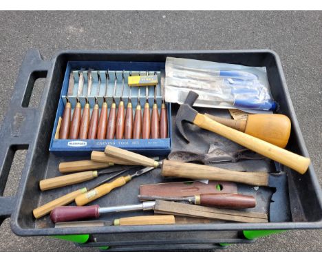 A box containing a collection of carpenters tools. 