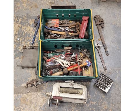 An assortment of tools, for mechanics and engineers, alongside an ACME mangle.