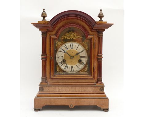 An early 20th century German mahogany bracket clock, the case with architectural arched foliate pediment above rectangular ap