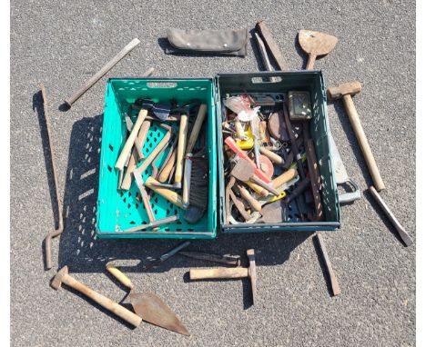 Two boxes containing a selection of builders hand tools to include a slate ripper. 