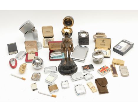 A collection of mid 20th century and later cigarette lighters, table, pocket and novelty examples, petrol and gas operated.