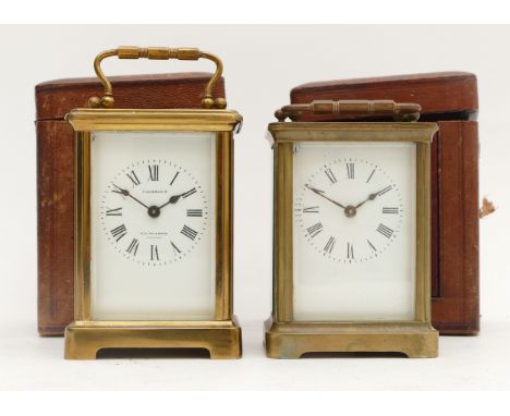 An early 20th century French brass carriage clock, white enamelled dial with Roman numerals, housing 8 day movement, with tra