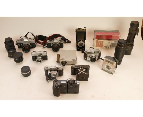 A Collection of cameras, to include Canon TX, Pentax ME Super, Kodak Retina II with Heligon Lens, cine camera, lenses