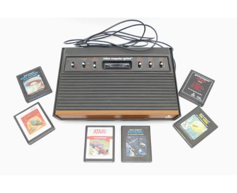An Atari games console, model CX-2600 U, with power lead and six games.