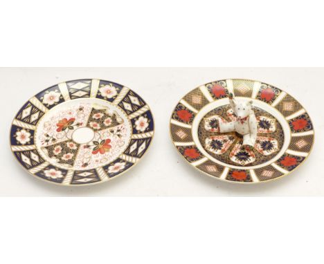 Royal Crown Derby; comprising two Imari plates 'Old Imari' BG1996, diameter 21.5cm, together with a seated bear paperweight, 