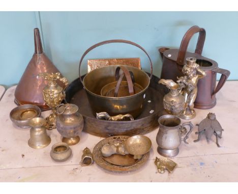 A collection of early 20th century and later brass and copper wares, to include a copper watering can, an oversized funnel, a