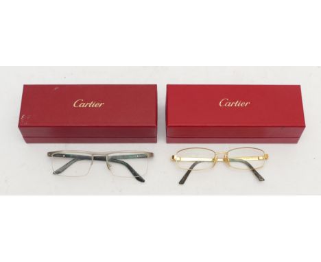 Two pairs of Cartier reading glasses, no. 135, 4591422 and no. 140, 54/18, boxed.