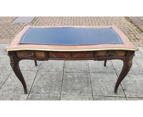 A French Ormolu Empire style desk, Kingswood with leather inset skiver with gilt brass detailing over long central drawer fla