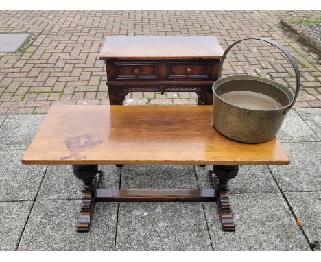 An oak side table with two drawers to the frieze, 61 x 31 x 70cm, an oak coffee table and a brass jam pan