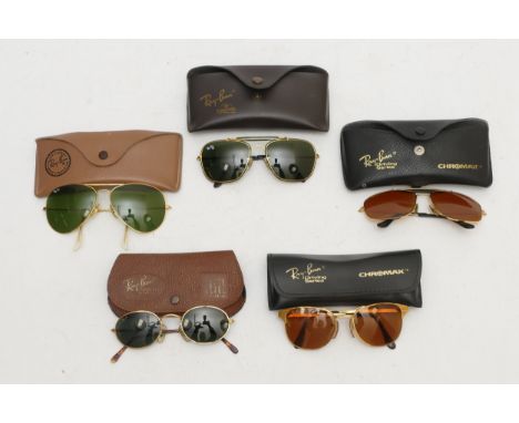 Five pairs of vintage Ray-Ban sunglasses, aviator W1699, W2051, aviator 58/14, oval W2108, aviator 62/14, all cased. Conditio