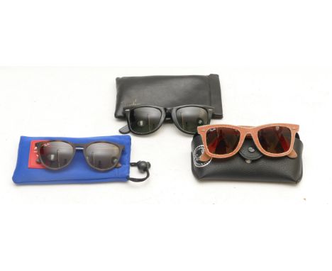 Three cased pairs of Ray Ban sunglasses . Condition:RJ906OS – Lenses are scratched relatively heavily.Wayfarers – Lenses suff