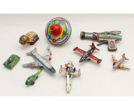 A collection of assorted Japanese and other Tinplate toys to include Daiya space gun, Yone clockwork bopping monkey, spinning