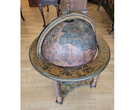 A mid 20th century globe drinks/cocktail cabinet, adjoined with classical illustration of Poseidon/Neptune and standing on tu