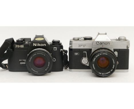 Two cameras, a Nikon FG-20 SLR, with 50mm  f/1.8 Series E lens, and a Canon FT with 50mm f/1.8 lens