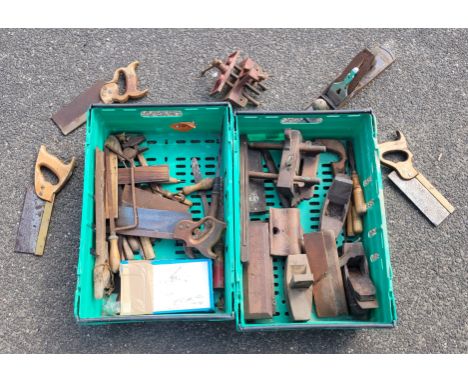 Two boxes containing a collection of carpenters hand tools and wooden planes.