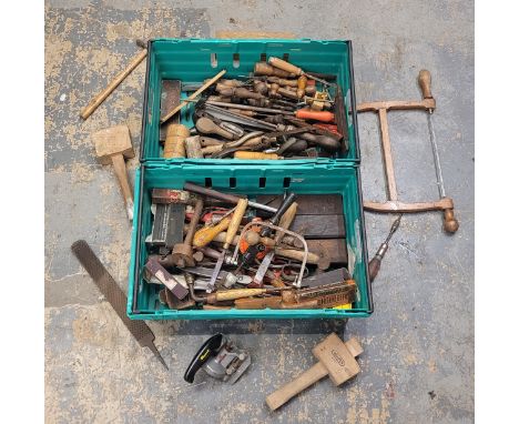 An assortment of carpenter's tools, stored in two plastic crates.