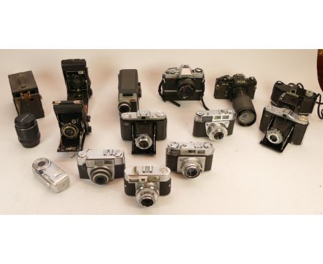 A Collection of Cameras to include Minolta X-300, Ricoh KR-10, 4x folding cameras, a Dallmeyer 4.5" enlarging lens, etc