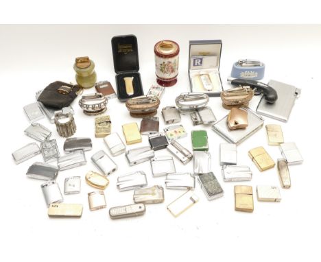 A collection of 20th century cigarette lighters, pocket, table and combination examples, petrol and gas operated.