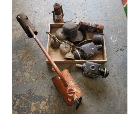 An assortment of tools, to include vintage lamps, brassware, and a gardener's flame gun.