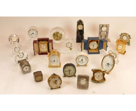 A collection of mid 20h century and later mantel, carriage and novelty clocks, having manual and quartz movements. (2)