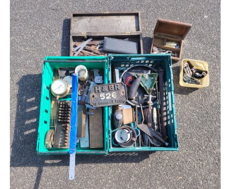 Two boxes containing a collection of marking, measuring instruments and other tools.