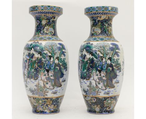 A pair of Chinese porcelain vases of baluster for in blue depicting a lakeside mountain scene in the background with a group 