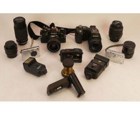 A Collection of Cameras to include Olympus OM10, Olympus XA2, a Half Plate brass bound lens, an Aldis lens, etc