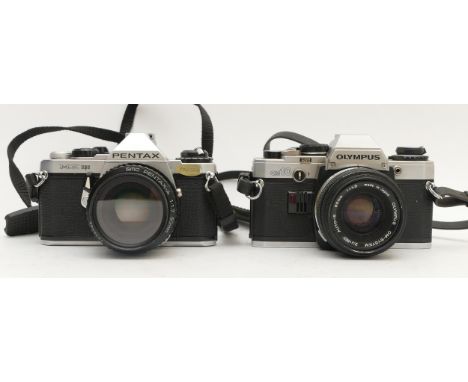 Two cameras, a Pentax ME Super with 50mm lens, and an Olympus OM-10 with 50mm lens