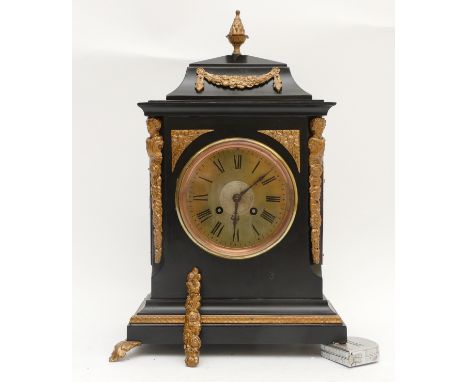 A French late 19th century ebonised and gold painted mantel clock, the movement by S. Marti et Cie, pendulum, lacking one foo
