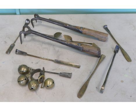 A collection of late 19th century primitive tools, to include, bale hooks, foundry implements, and crotal bells.