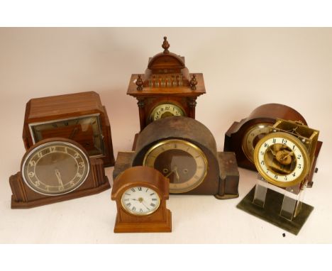 A collection of mid 20h century and later mantel, carriage and novelty clocks, having manual and quartz movements. (2)