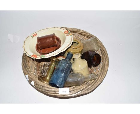 Basket containing various vintage bottles, jars and other items