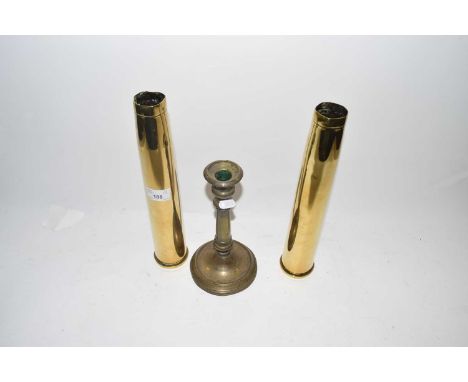 Pair of brass shell cases and a brass candlestick