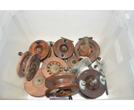 Box of various vintage wooden centre pin fishing reels and associated parts