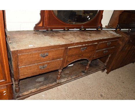 19th Century oak five drawer dresser base on turned supports with base shelf (requiring restoration), 178cm wide