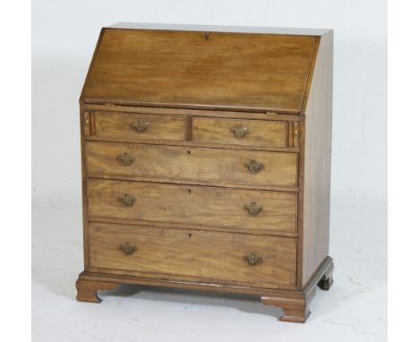 Small mahogany bureau in Georgian style, the sloping front opening to reveal a central cupboard door, pigeonholes and drawers