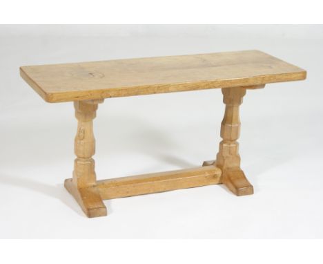 Robert Thompson of Kilburn (The Mouseman) oak coffee table, the adzed top on tapered octagonal supports carved with a mouse, 