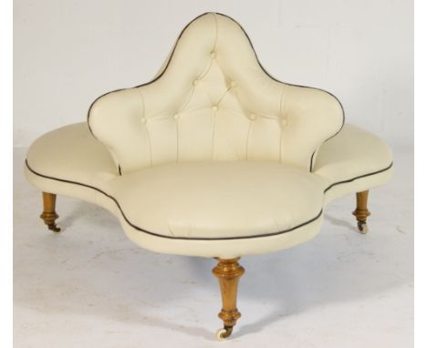 Victorian mahogany framed conversation seat, traditional triform shape upholstered in cream leather with deep button back, ra