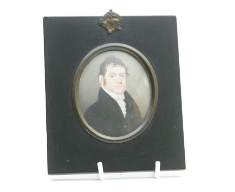 English School (early 19th Century), Portrait miniature of a gentleman in a black coat and white ruffled shirt, on ivory, ova