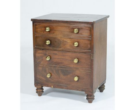 Early Victorian mahogany commode, circa 1840, the lift up top with two blind drawer front with brass knobs, opening to reveal