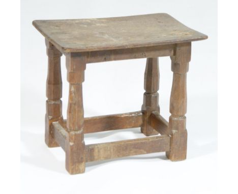 Robert Thompson of Kilburn (The Mouseman) oak stool, solid seat over tapered octagonal supports with a carved mouse, stretche