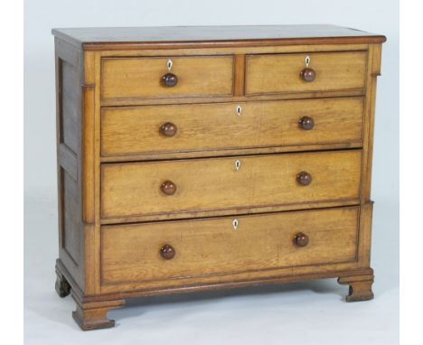 Oak chest of drawers, early 19th Century, fitted with two short and three long graduated drawers, each with turned wooden kno