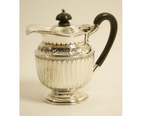 Edwardian silver hot water jug, maker HA, Sheffield 1903, lidded baluster form with fluted sides, ebony finial and handle, 14