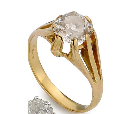 Diamond solitaire ring, the old brilliant cut stone estimated as 1.25ct in a yellow metal claw mount and ring, size K, gross 