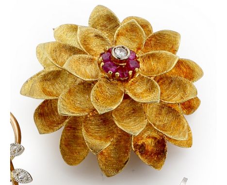 Yellow gold diamond and ruby flowerhead brooch, centred with a small diamond bordered with six small brilliant cut rubies, in