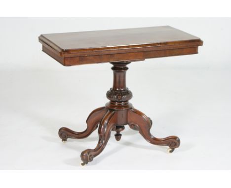 Victorian mahogany pedestal card table, circa 1845, the top with moulded edge swivelling and folding to reveal a baize playin