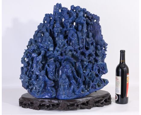 Large Chinese Carved Lapis Boulder on Stand. Signed with characters on the upper right portion of the sculpture. With intrica
