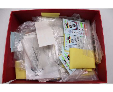 One tray containing a quantity of various mixed scale kit building race car transfers and white metal accessories, to include