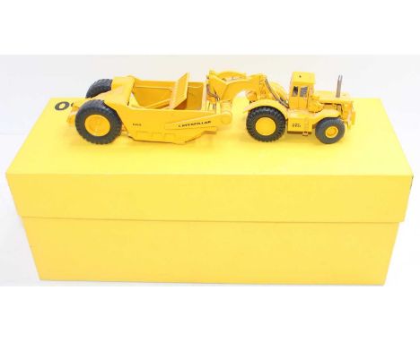 Black Rat Models 1/50th scale white metal/diecast model of a CAT Caterpillar 660 Scraper, finished in yellow, housed in the o